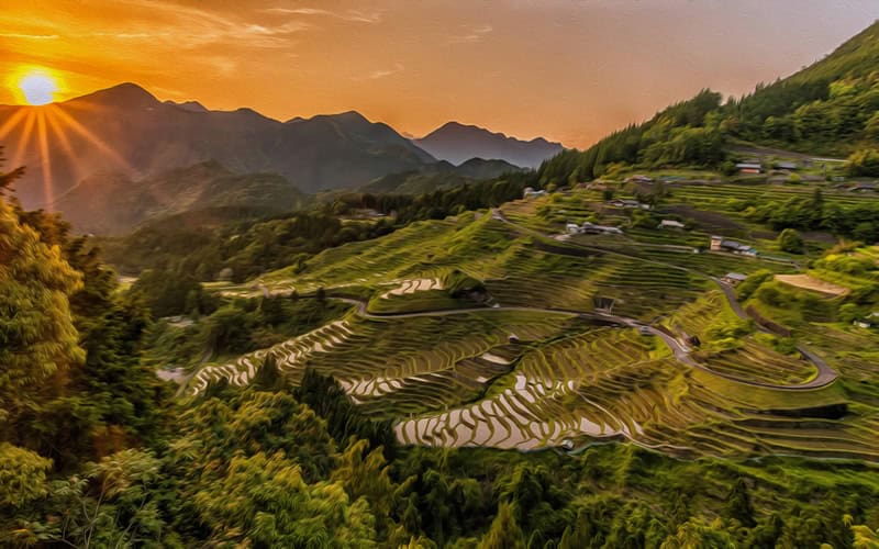 Beautiful mountain landscape with terraced fields at sunset.